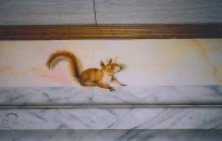  Squirrel of our wood on a pediment in imitation hones marbled.