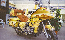 Gold Wing Honda personalized with a decoration of desert, portrait of Indian, horses, on marbled patina.