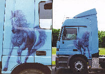 Tuning truck: cabin decorated by a painting personalized with pulled up horse.