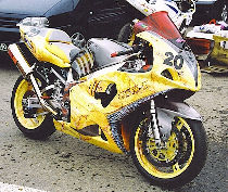  Motor bike of competition covered with a personalized painting (side view).