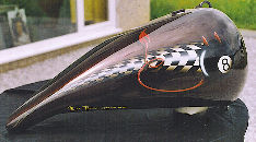 Tank of motor bike painted with a checkerwork.
